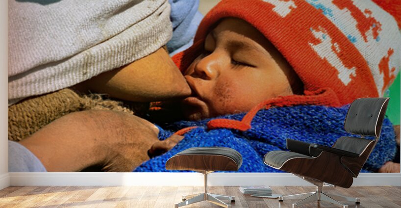 Indigenous mother nourishes child in the Andes of Argentina Wall Murals