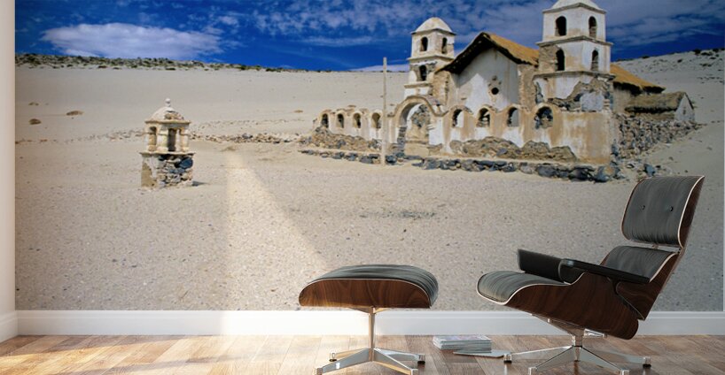 Old church ruins in a desolate sandy landscape. Wall Murals