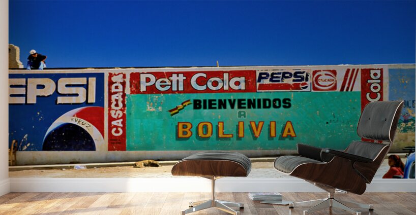 Welcome to Bolivia sign on a wall with old ads. Wall Murals