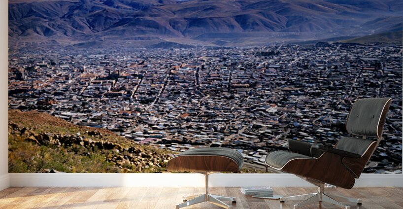 Panoramic view of a sprawling city in a mountain valley. Wall Murals