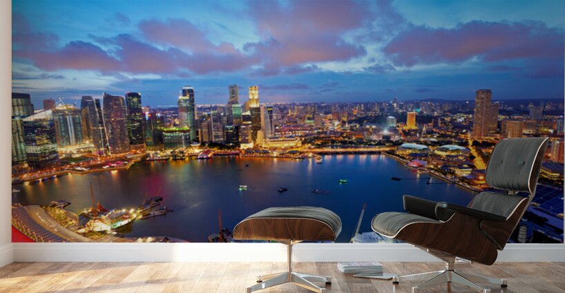 City lights shine over Marina Bay in Singapore at sunset Wall Murals