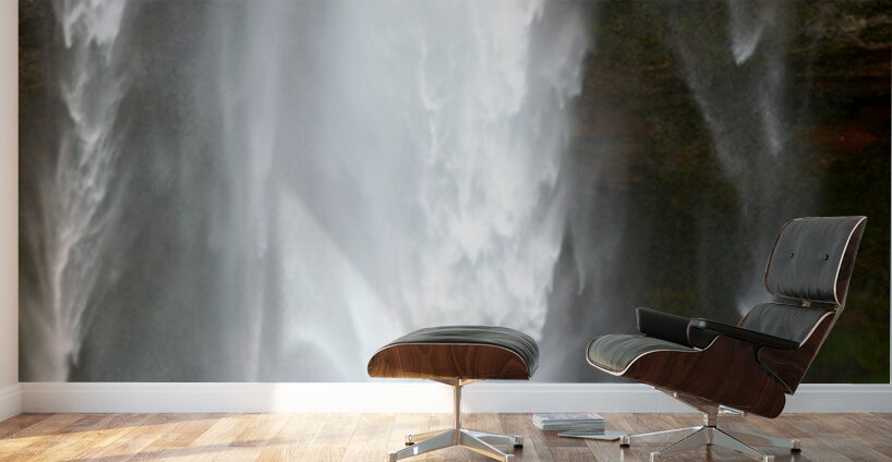 Woman walks near Seljalandsfoss waterfall in Iceland Wall Murals