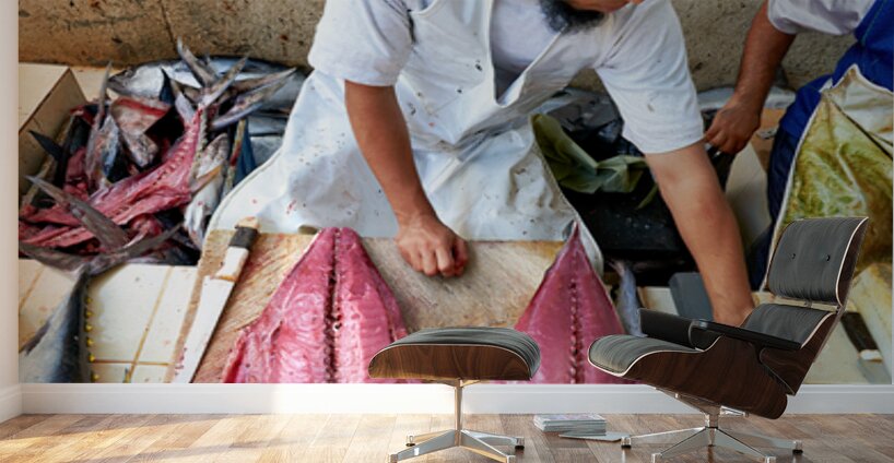 Fish market in Muscat Oman shows a vendor at work Wall Murals