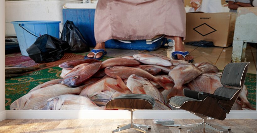 Man sells fresh fish at Muscat Oman fish market today Wall Murals