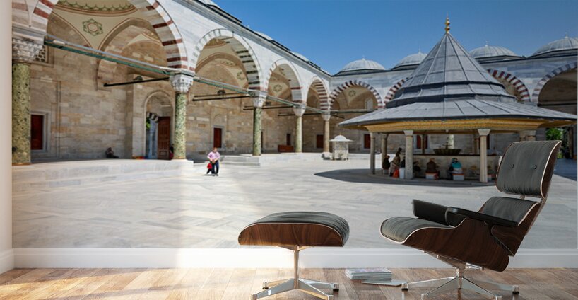 Visitors explore the courtyard at Fatih Mosque in Istanbul Wall Murals