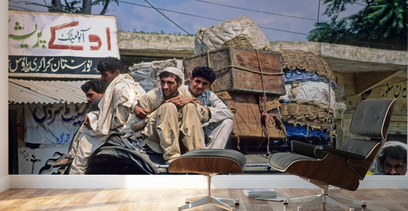 Men travel on top of a vehicle in Peshawar Pakistan Wall Murals
