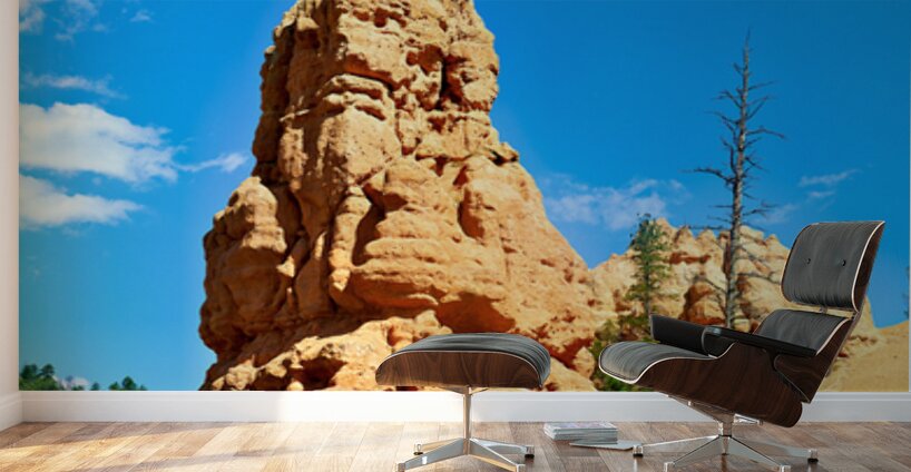 Rock formation towers over trees in Dixie National Forest Wall Murals