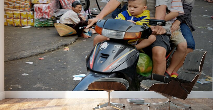 Motorbike family ride through busy Ho Chi Minh street in Vietnam Wall Murals