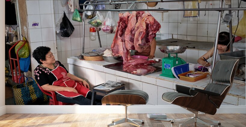 Market scene in Ho Chi Minh City with meat vendor and customer Wall Murals