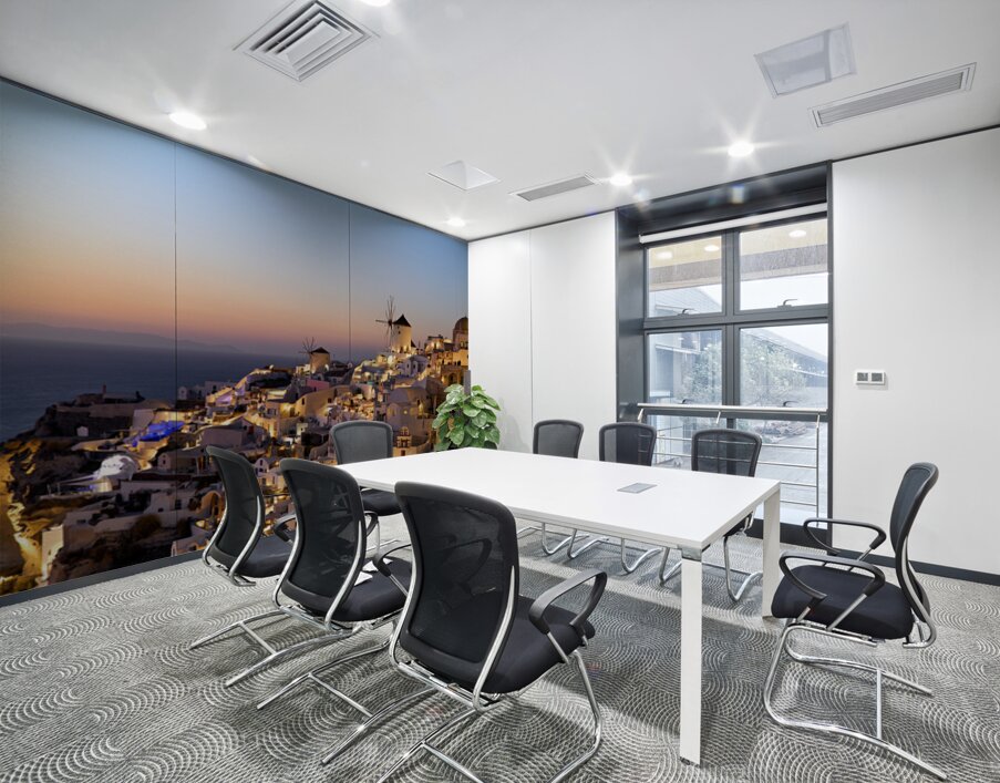 Santorinis Oia village glows at twilight by the sea. Wall Printing