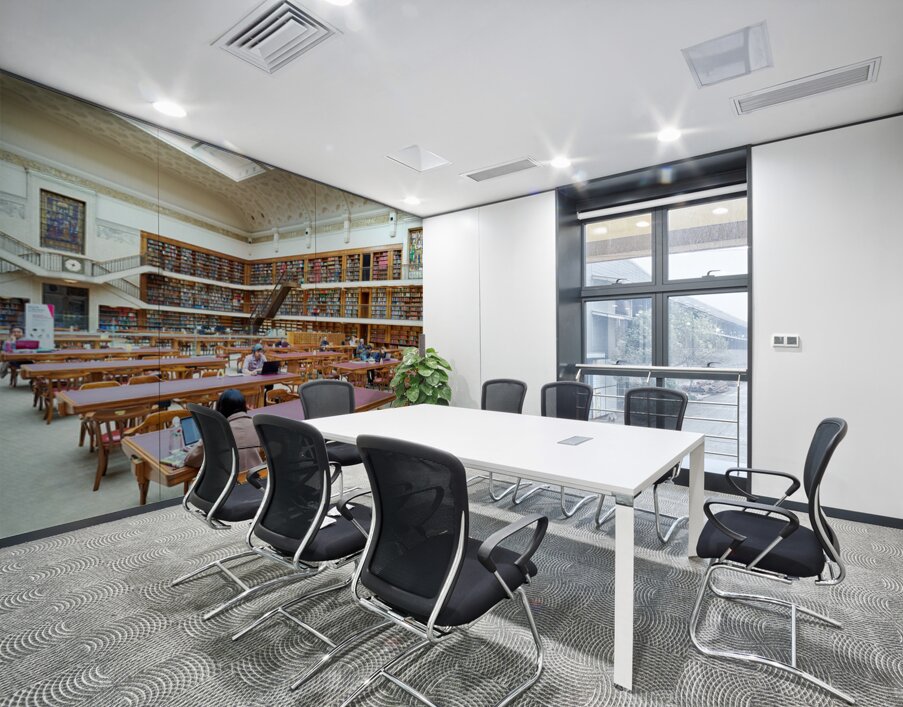 People study in the grand reading room of Mitchell Library in Sy Wall Printing
