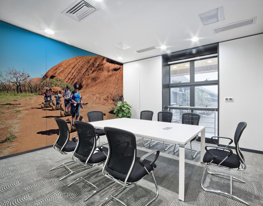 Tourists ride Segways near Uluru in Australia. Wall Printing