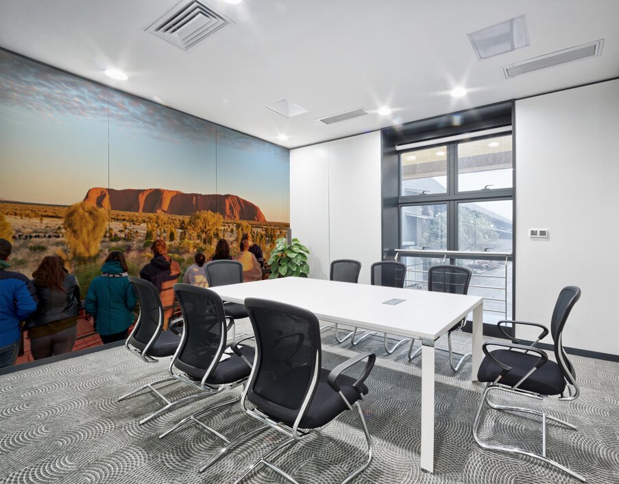 Tourists watch Uluru glow at sunrise. Wall Printing