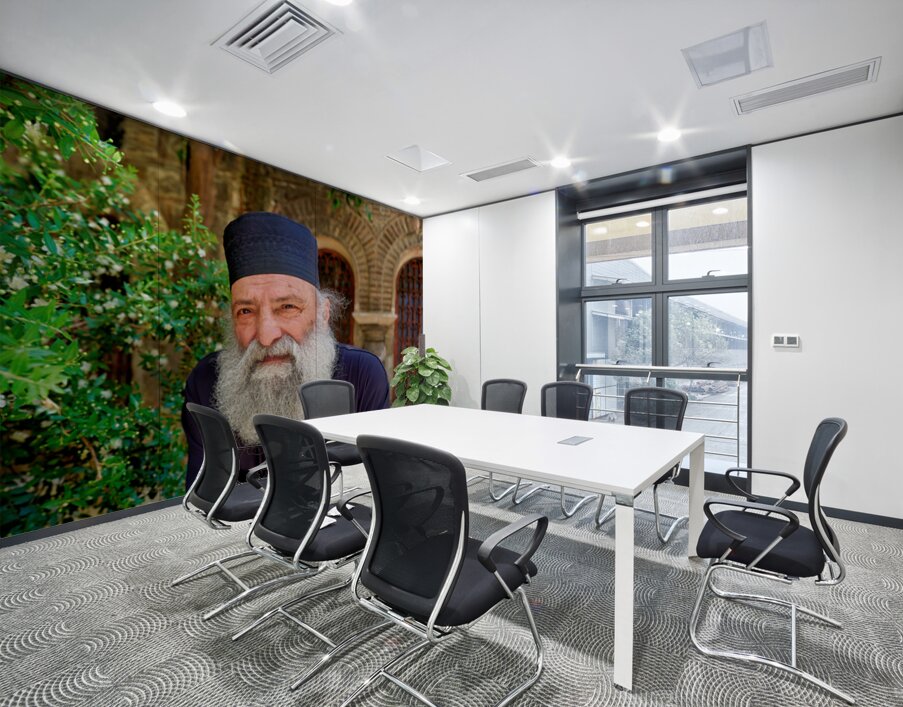 Elderly man with a beard poses near a historical building in a g Wall Printing