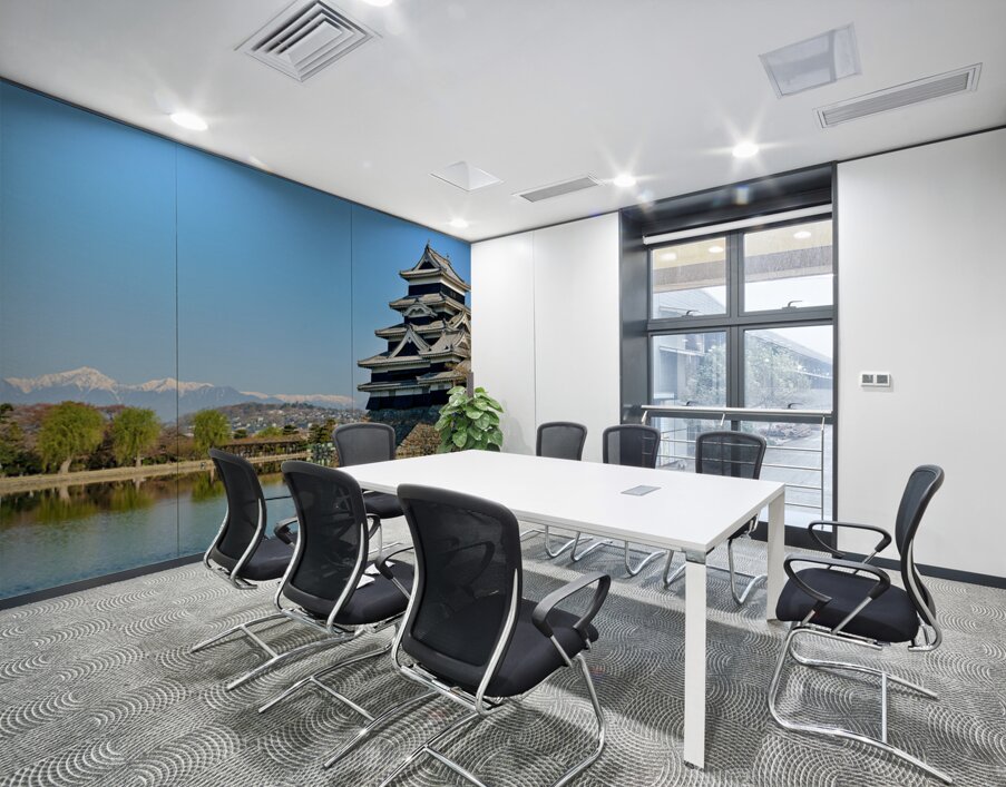 Matsumoto Castle stands beside water with mountains in the dista Wall Printing