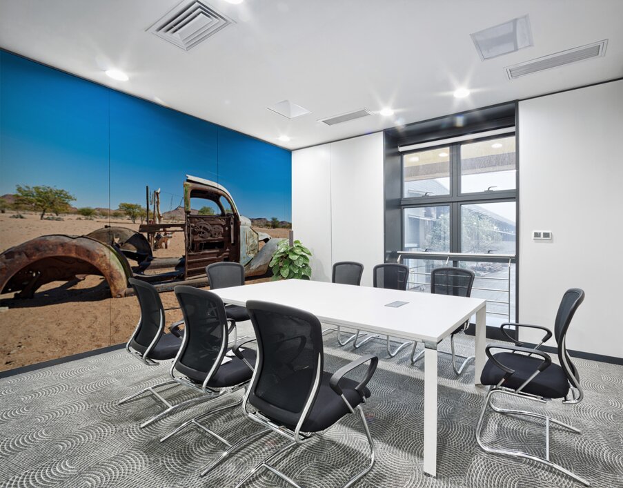 Classic car wreck rests in the Namib desert under a clear sky Wall Printing