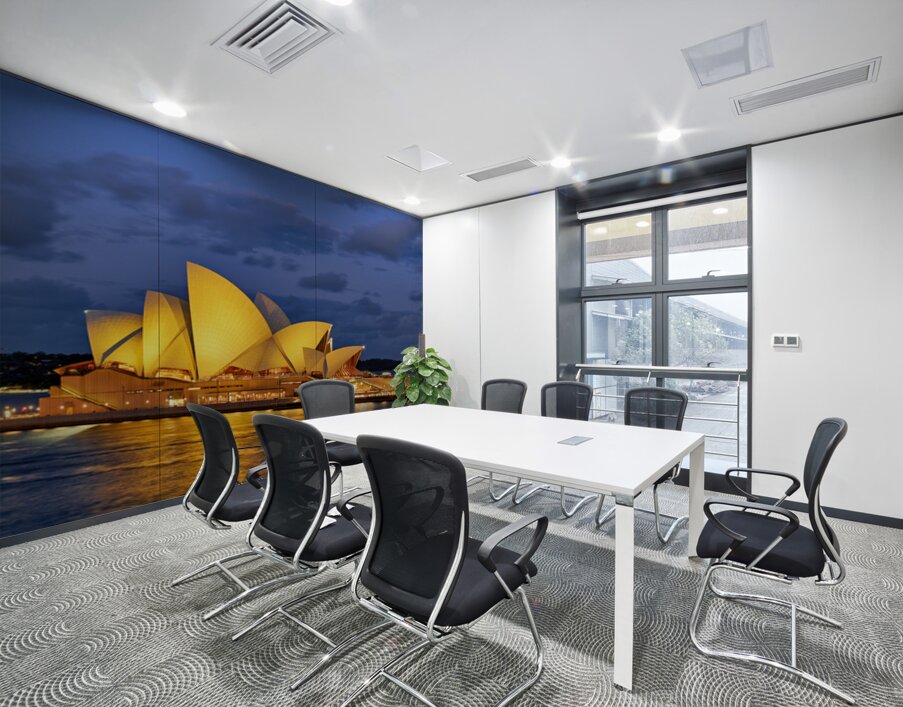 Sydney Opera House illuminated at dusk with harbor lights. Wall Printing