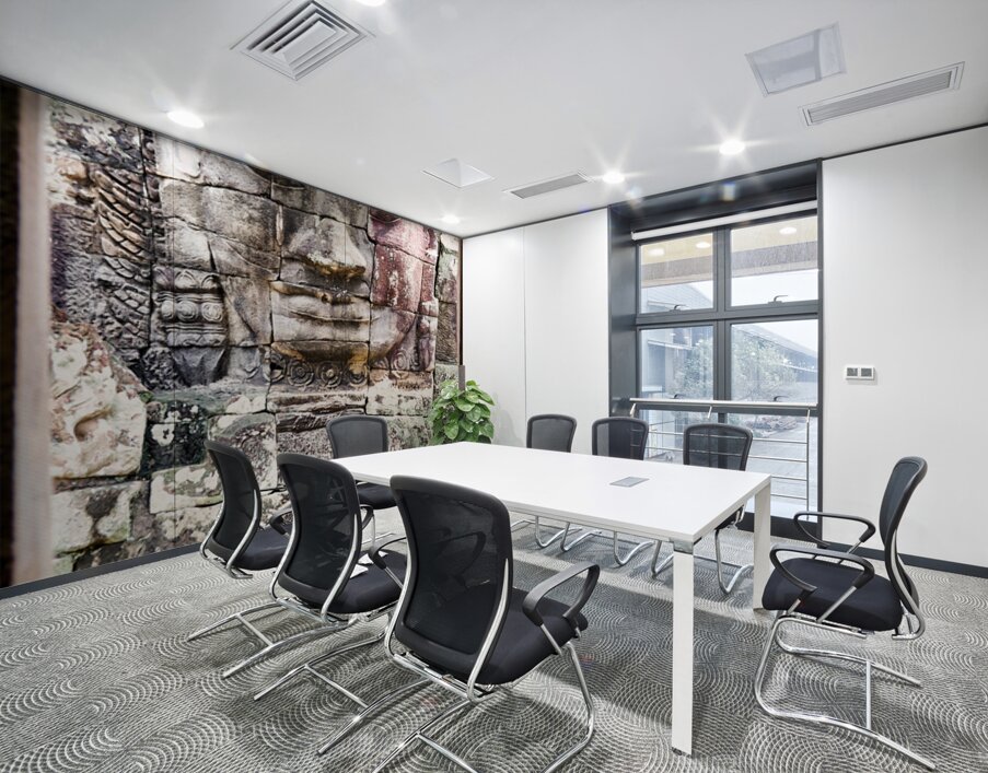 Ancient stone face carving framed in temple window. Wall Printing