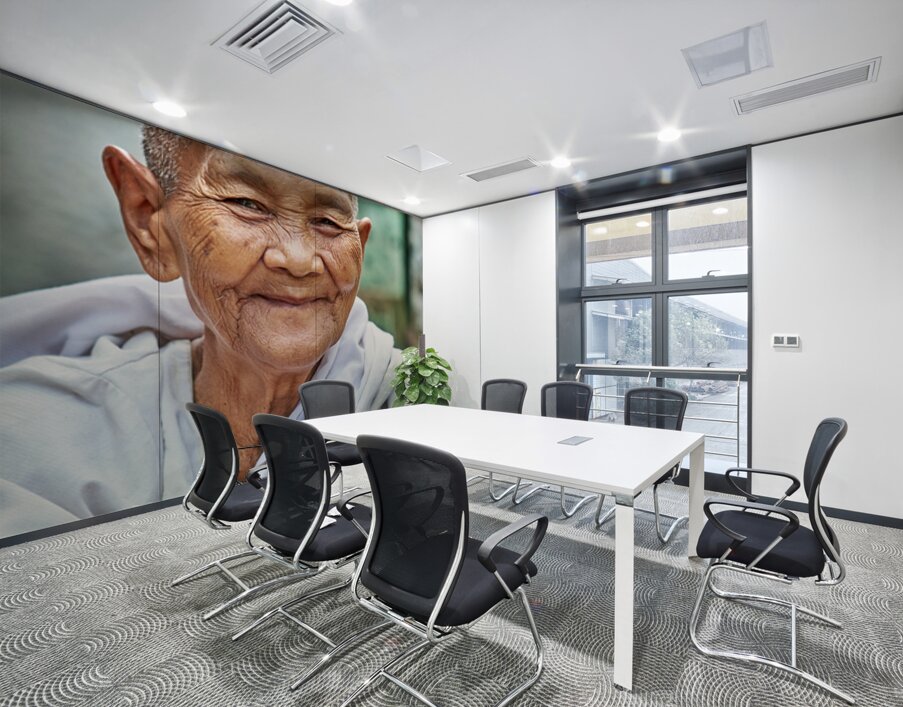 Smiling elderly Asian woman in white robe. Wall Printing