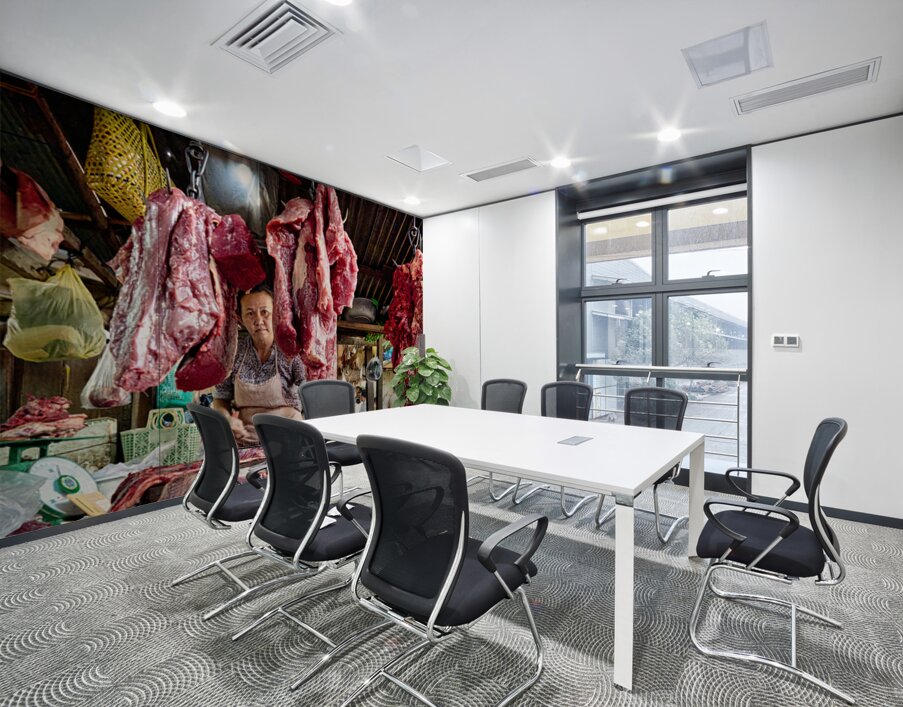 Woman selling raw meat in a bustling market. Wall Printing
