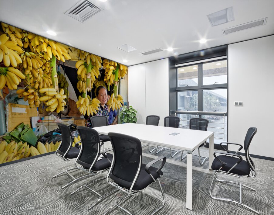 Market vendor surrounded by abundant yellow bananas. Wall Printing