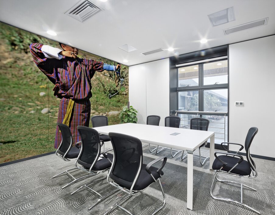 Bhutanese archer in traditional Gho aiming a compound bow. Wall Printing