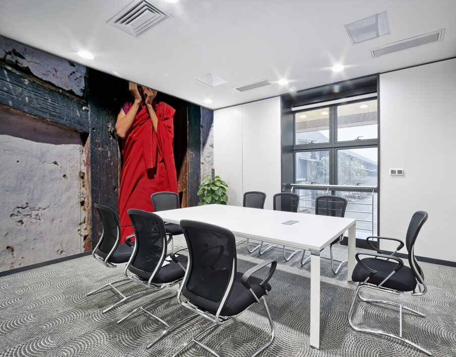 Monk in red robes on cell phone. Wall Printing