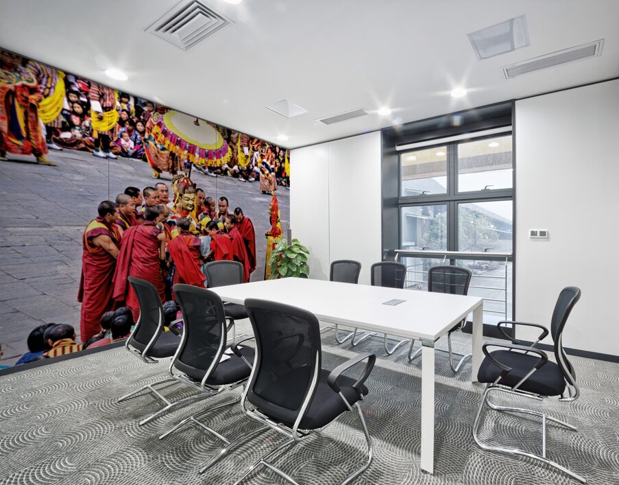Monks in red robes gathered around a golden statue. Wall Printing