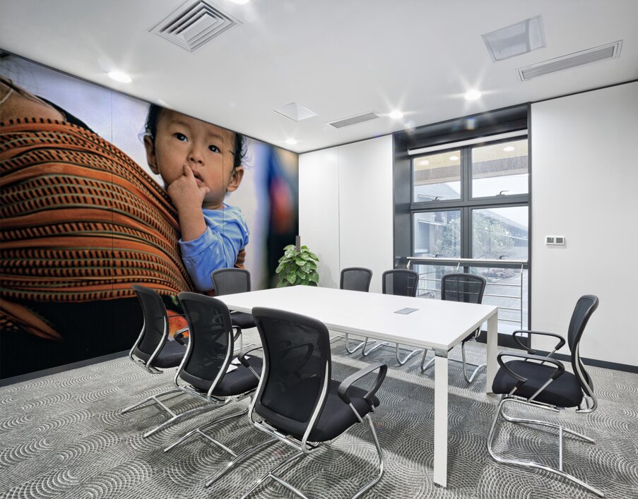 Curious child carried in a patterned fabric sling. Wall Printing
