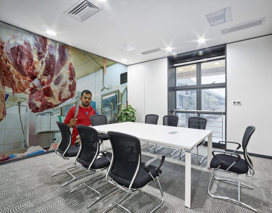 Butcher works with meat in a shop in Dubai UAE Wall Printing