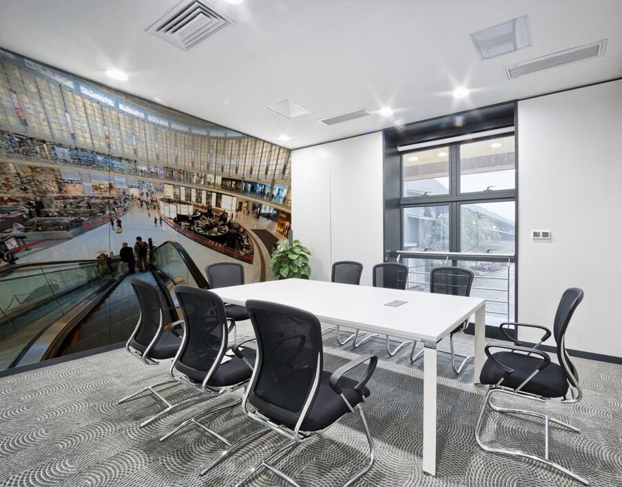 Busy shopping mall in Dubai with escalators and various stores Wall Printing