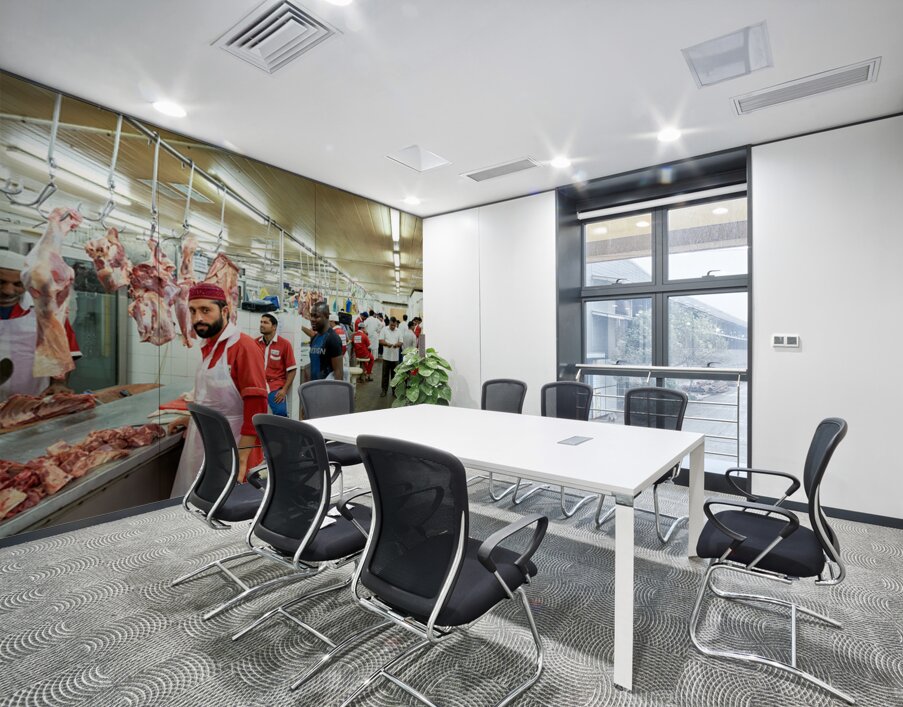 Butchers work at a busy meat market in Dubai UAE preparing fresh Wall Printing