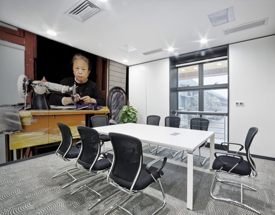 Elderly woman sews at machine in Shanghai China Wall Printing