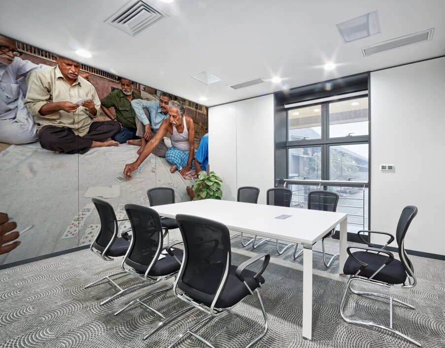 Men playing cards on the street in Bikaner Rajasthan during the Wall Printing