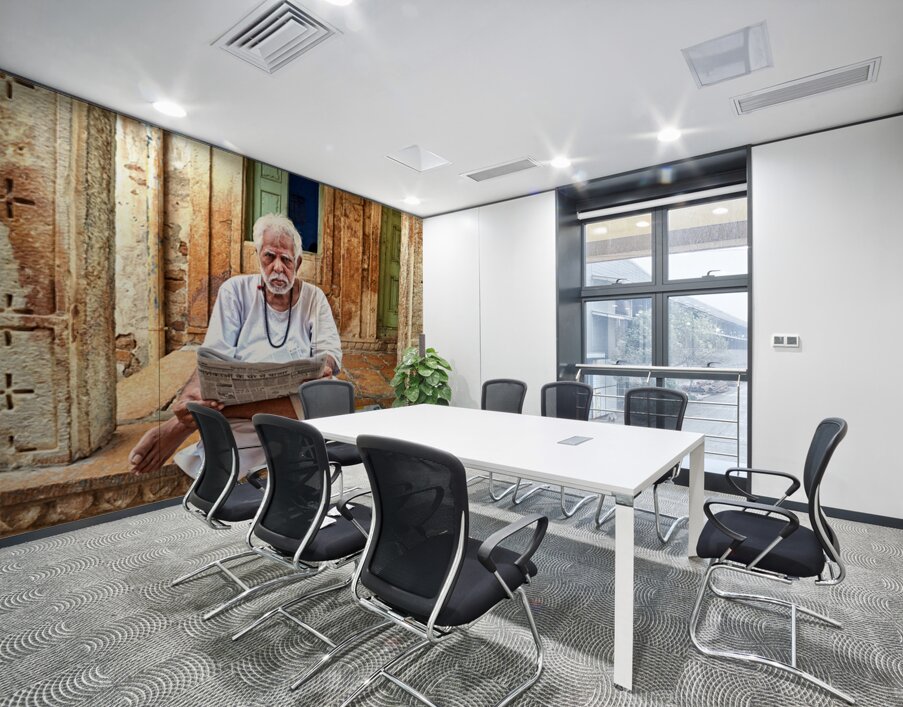 Man reads newspaper on street in Jaisalmer Rajasthan India Wall Printing