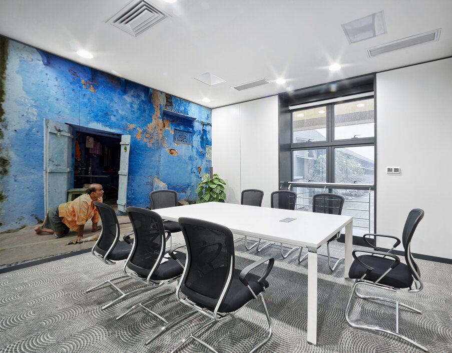 Man sweeps in front of home in Bundi Rajasthan during the day Wall Printing
