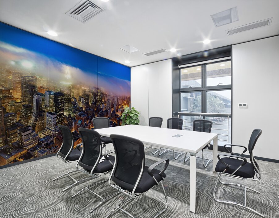 Aerial view shows Manhattan skyline at dusk with city lights Wall Printing