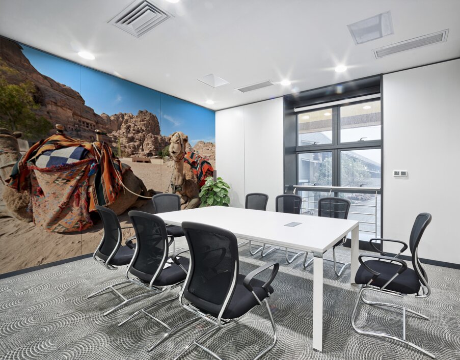 Tourists ride camels at Petra archaeological site in Jordan Wall Printing