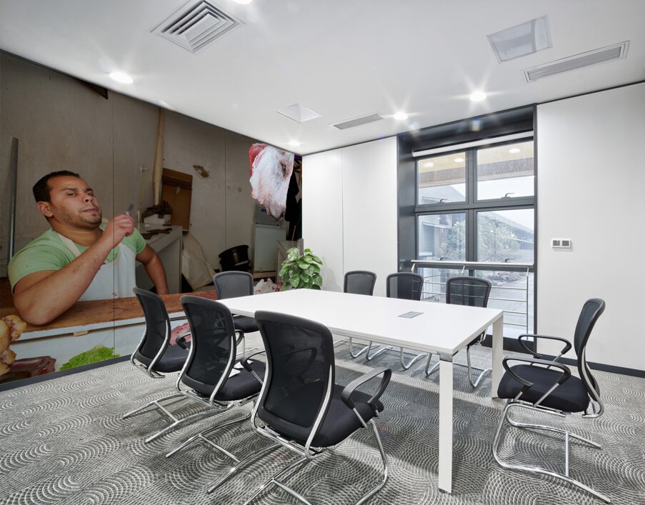 Butcher at work in Meknes souk showing fresh meat and livestock Wall Printing