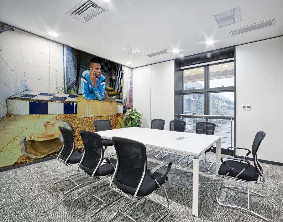 Butcher in Meknes souk interacts with customers during market ho Wall Printing