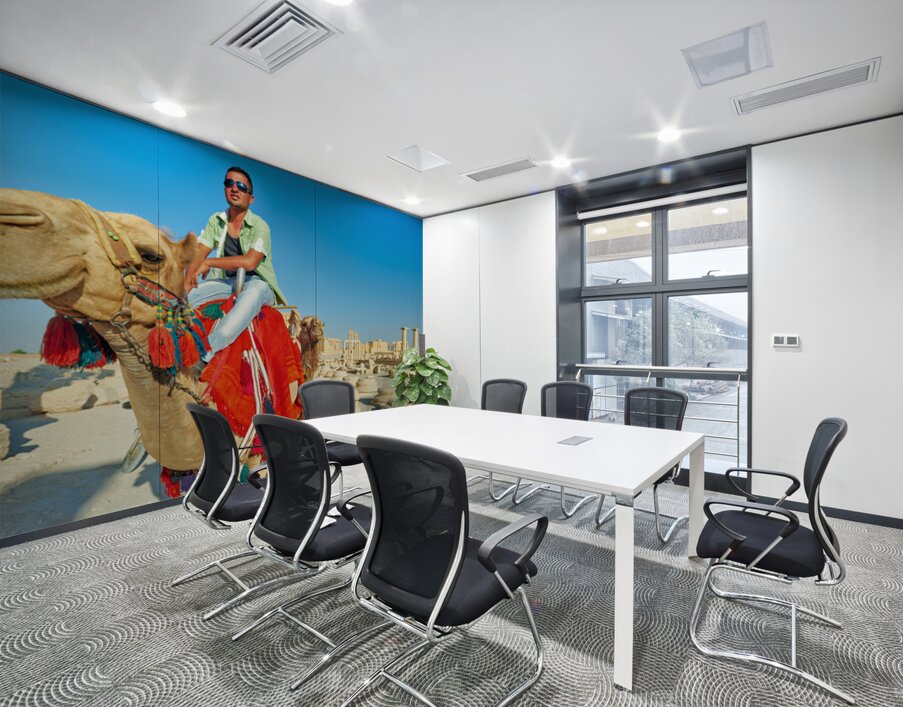 Camel driver in ancient Palmyra leading a tourist ride Wall Printing