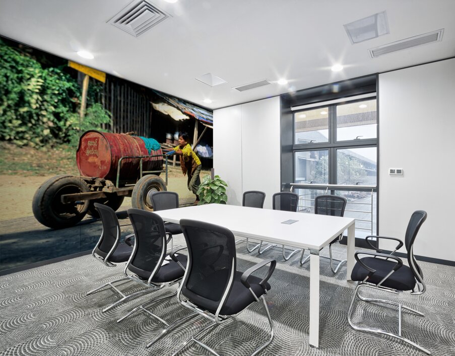 Boy pushes a cart down the street in Myanmar during the day Wall Printing