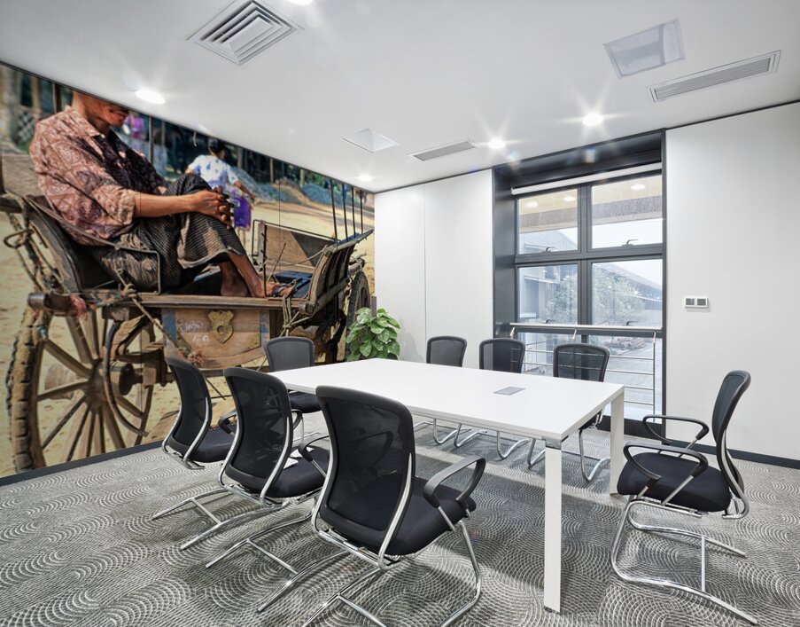 Man rests on cart in Myanmar during warm daytime Wall Printing