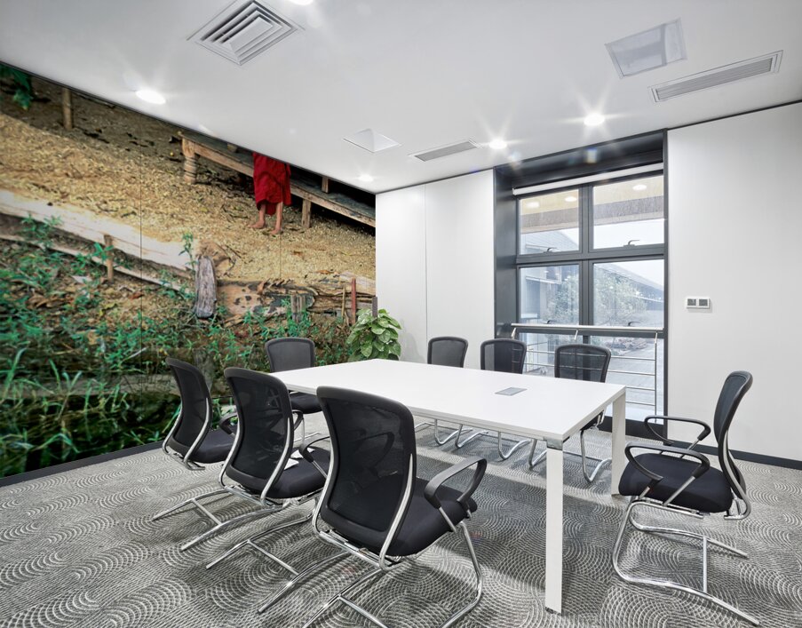 Young monk stands by water in Myanmar during daytime Wall Printing