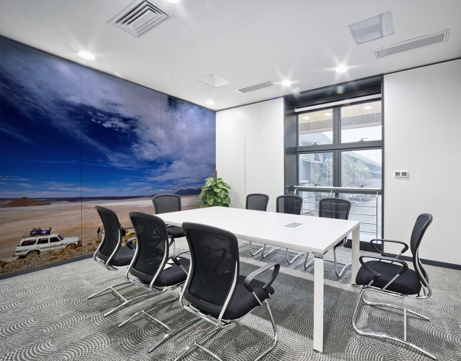 Vehicles traverse a vast arid salt flat landscape. Wall Printing