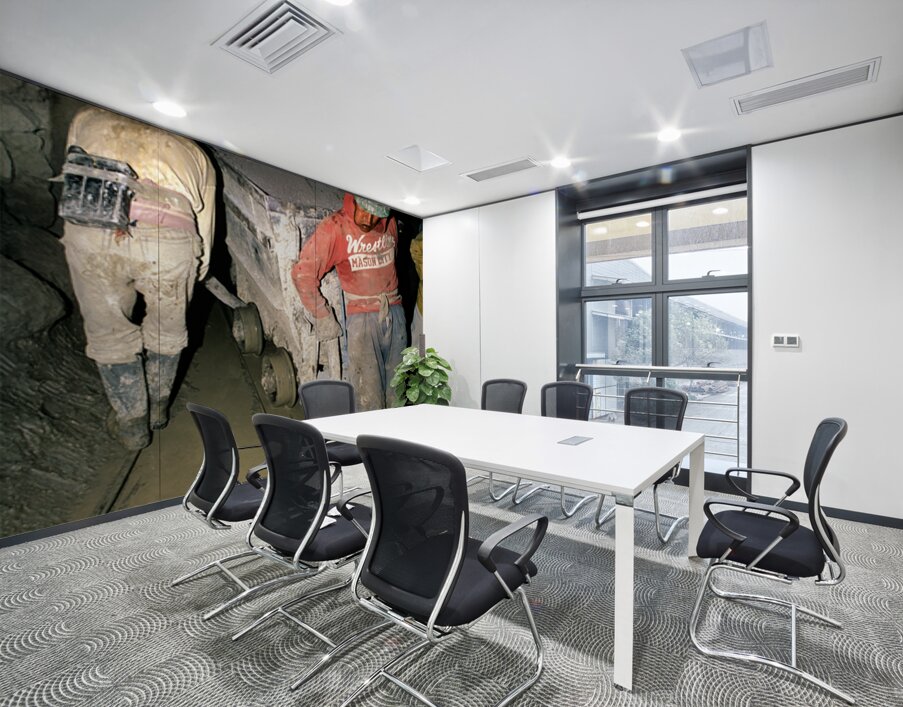 Miners pushing a loaded cart through a muddy underground mine. Wall Printing