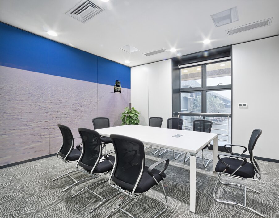 Van driving across vast white salt flat under blue sky. Wall Printing