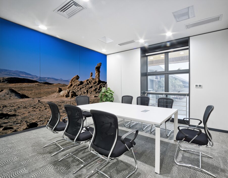 Arid desert with unusual rock pillars against a blue sky. Wall Printing