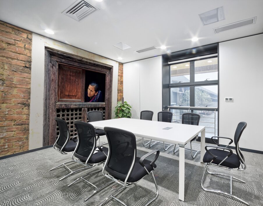 Woman in Kathmandu looks out from window in old building Wall Printing
