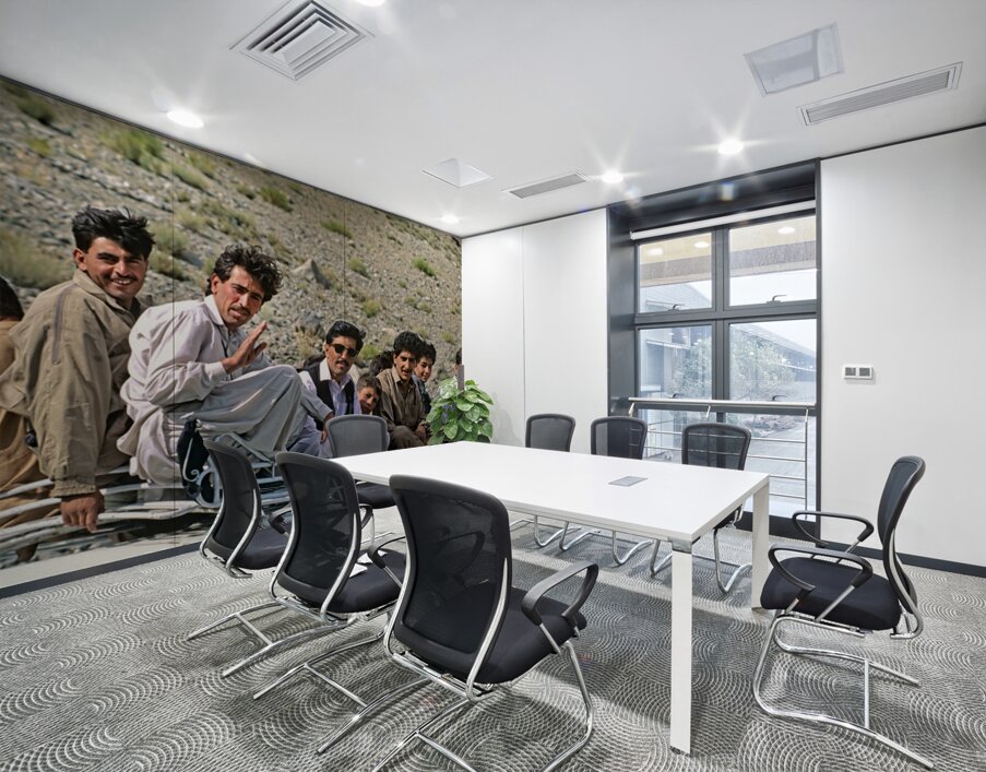 Group traveling on top of a van in Pakistans mountains Wall Printing